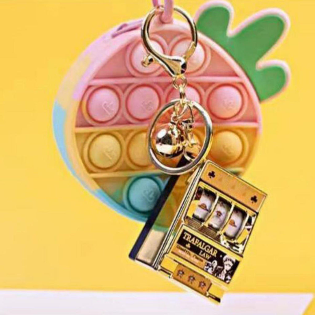 Porte-clés Luffy/Zoro Machine à sous fruitée Pendentif livre pop-up Machine à sous
