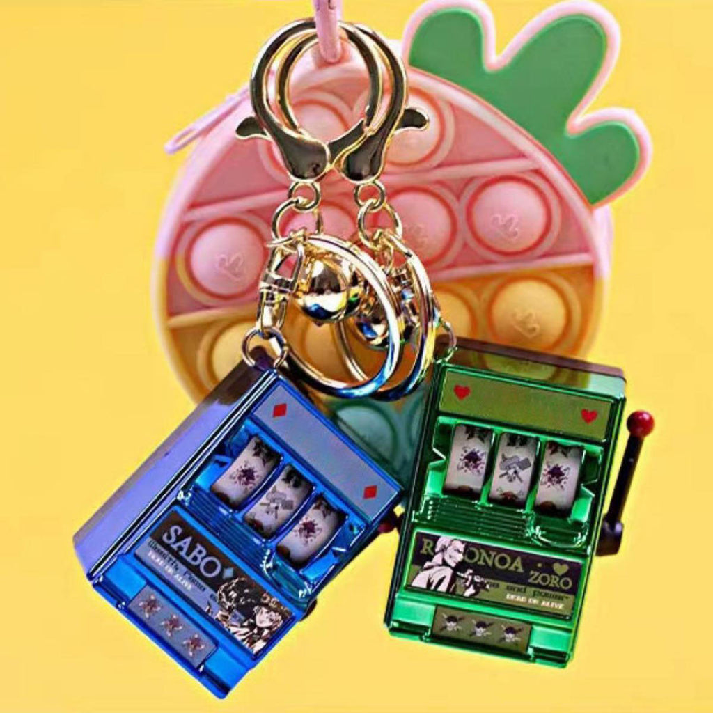 Porte-clés Luffy/Zoro Machine à sous fruitée Pendentif livre pop-up Machine à sous